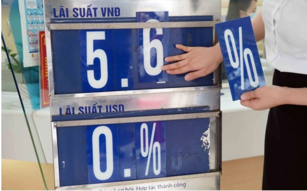 Từ hôm nay, Ngân hàng Nhà nước giảm trần lãi suất cho vay ngắn hạn bằng đồng Việt Nam xuống 5%/năm. Ảnh minh họa